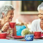 elderly women sipping tea
