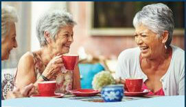 elderly women sipping tea