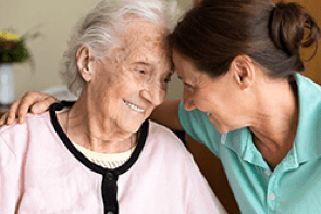 woman smiling with elderly woman