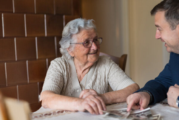 Senior woman talking to professional about senior living communities