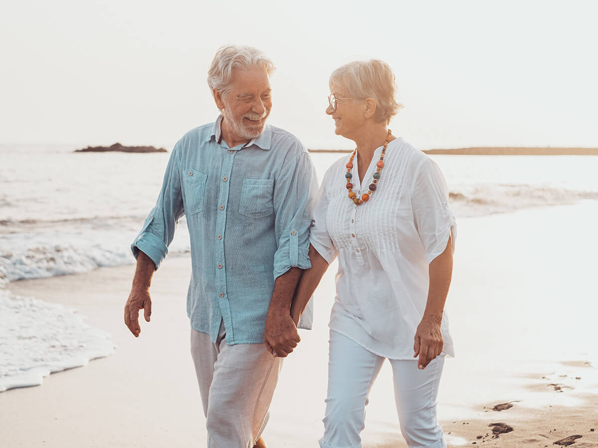 senior walking holding hands